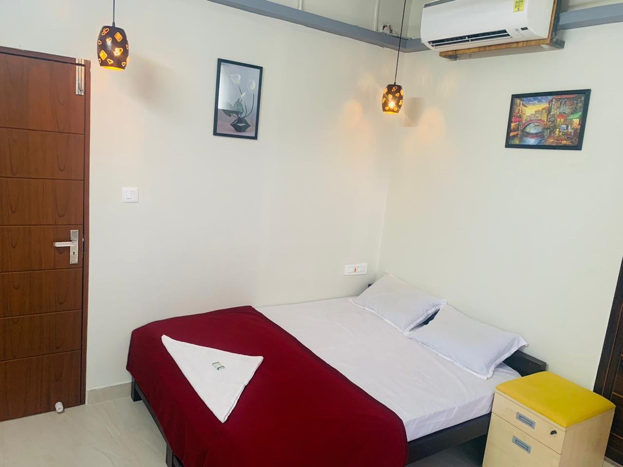 Royo Rooms with red bedspread